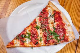PIZZA FACTORY LOCATED AT LONG ISLAND CITY NY : WHITE WITH SPINACH PIZZA SLICE