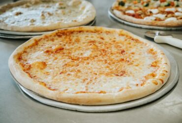 Carnival Restaurant & Pizzeria of Port Jefferson Station, NY Cheese Pizza Slice