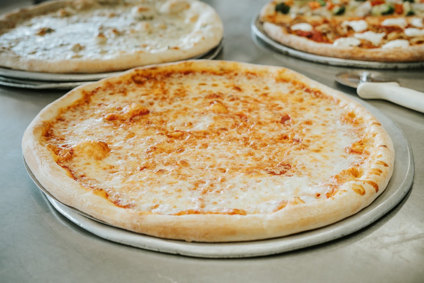 Carnival Restaurant & Pizzeria of Port Jefferson Station, NY Cheese Pizza Slice